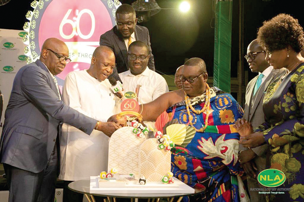From right: Nii Ayi Bonte, Gbese Mantse, Sammy Awuku, Director-General of NLA, Togbui Nyonyo Francis Seth, Board Chair of NLA and President of African Lotteries Association, and Dramani Coulibaly cutting the cake