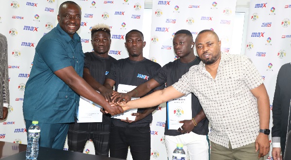 Maxwell Techie (right), President and CEO of IMAX Boxing Promotions, with the three signed boxers and the president of the Ghana Boxing Authority, Abraham Kotei Neequaye