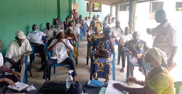 Daniel Kwabena Adane (right), Chairman of the Akweley, Ottamens and Ofankor branch of the Pensioners Association of Ghana, addressing the pensioners