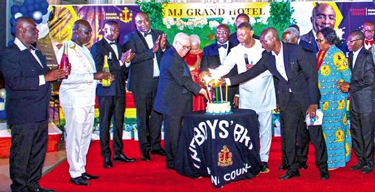 Moses Foh-Amoaning (5th from left),  President of the Boys Brigade; Dr Lawrence Tetteh (4th from right), Founder of the Worldwide Miracle Outreach, and other dignitaries lighting candles  to mark the anniversary, while Dr Bawumia (middle) looks on