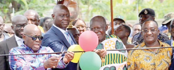 President Akufo-Addo being supported by Otumfuo Osei Tutu II (2nd from right) and Justice Anin Yeboah (2nd from left) to cut the tape to inaugurate the housing complex. Looking on include Dr Owusu Afriyie Akoto (right), the Minister of Food and Agriculture, and Godfred Yeboah Dame, the Attorney-General and Minister of Justice