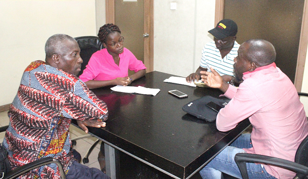 Ebenezer Korley (right), leader of the team of aggrieved customers of NDK Financial Services, narrating their ordeal to Jemima Okang Addae, Graphic Reporter. Picture: ERNEST KODZI