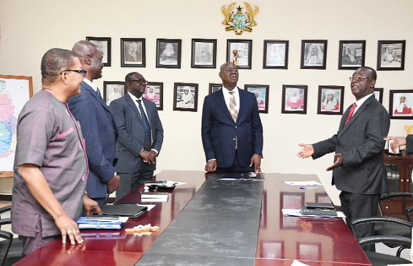 Justice Baffoe Bonnie (right) sharing a thought with the new NMC members; Kobby Asmah (left) and Gabriel Bosompem (2nd from left). Looking on are Chief Justice Anin Yeboah (2nd from right) and George Sarpong (3rd from right). Picture: EBOW HANSON