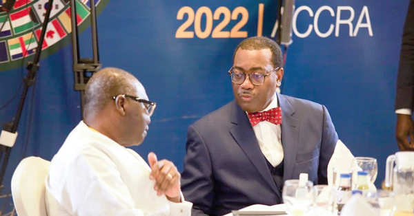 Dr Akinwumi A. Adesina (right), President of the AfDB, interacting with Ken Ofori-Atta, Minister of Finance, during the AfDB meeting in Accra yesterday