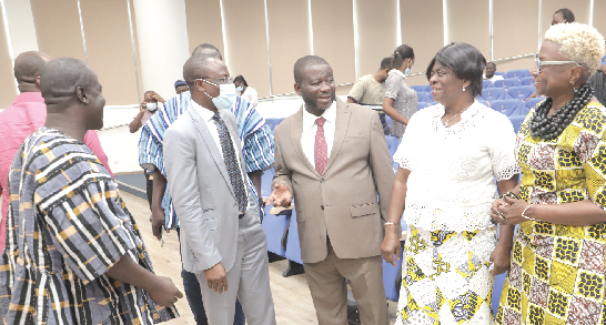 Nana Agyemang (middle), Director General, NADMO interacting with Adelaide Anno-Kumi (2nd from right), Chief Director, Ministry for the Interior, after the opening session of the meeting. With them are Samuel Gmalu (left), Head, Humanitarian and Emergency Affairs Unit, World Vision; Dr Ngoy Nsenga, Representative, WHO to Central African Republic and Team leader of CADRI Diagnostics Mission in Ghana, and Barbara Tulu Clemens (right), Representative and Country Director, World Food Programme. Picture: SAMUEL TEI ADANO