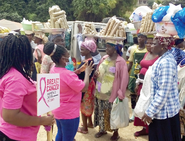  Mabel Kudjoe, a VRA health worker, educating some market women at the Senchi market