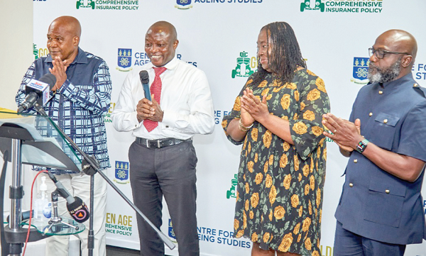 Kwabena Addison (right), CEO of Quality Insurance Company; Prof. Mavis Dako-Gyeke (2nd from right), Director of the Centre for Ageing Studies, with some officials at the event after the launch of the summit