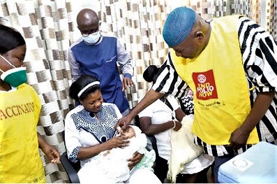 Alhaji Mahama Asei Seina (right), a Deputy Minister of Health, administering the polio vaccination at the launch. Picture: EDNA SALVO-KOTEY