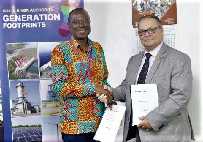 Emmanuel Antwi-Darkwa (left), Chief Executive of VRA and Terry Drabiuk, President of CPI Training, exchanging the documents after signing the MoU 