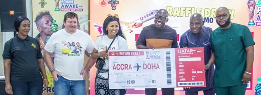 Nana Ama Mcbrown, (3rd from left) Brand Ambassador for Puma drinks, Greg Pitt (2nd from left) Deputy MD at Kasapreko Company Ltd and officials of the NLA holding the dummy ticket