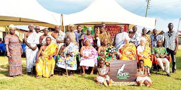 Togbe Keh XII (seated 4th from left), the Divisional Chief of Gbi-Wegbe, and Larry and Shiella Penner (seated 2nd and 3rd from right), Canadian couple, with other traditional leaders and elders of the town