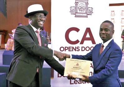 Professor Williams Abayaawein Atuilik (left), President of the ICAG, presenting the Overall Best Student award to Richard Nyame, at the 39th ICAG Graduation and Admission Ceremony