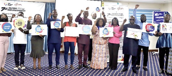 Cecilia Senoo (5th from right), Executive Director, Hope for Future Generations; Ernest Amoabeng Ortsin (4th from left), President of the Ghana HIV and AIDS Network; David Kwesi Afreh (6th from right), National Board Chairman, Stop TB Partnership Ghana, and other dignitaries with placards on information on the 7th Global Fund Replenishment after the media briefing. Picture: EDNA SALVO-KOTEY