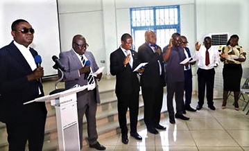 Teriwajah Justin Pwavra (left), a private legal practitioner, inducting the new executives into office