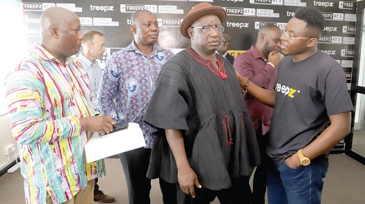 Isidore Kpotufe (right), Country Manager of Treepz, interacting with Godfred Abulbire (3rd from left), General Secretary of GPRTU, at the meeting in Accra. With them are Isaac Esau (2nd from left), Deputy General Secretary of the GPRTU, and  Charles Narnor (left), Project Manager of the GPRTU.  Picture: GABRIEL AHIABOR