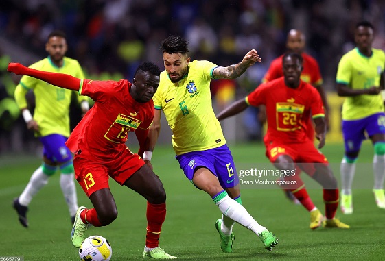 Felix Afena-Gyan of Ghana battles for possession with Alex Telles of Brazil