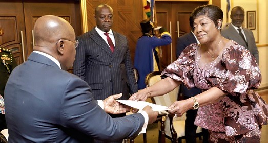 Jeannette Njuma Nyakeru (right), Congolese Ambassador to Ghana, presenting her letters of credence to the President