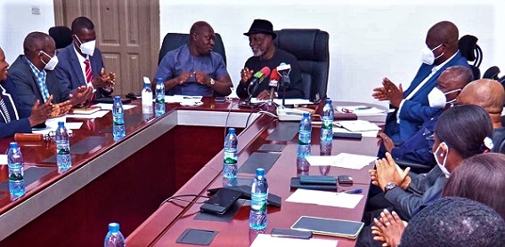 Kabral Amihere (in hat), Board Chairman of GRIDCo and Kwame Ejalu Ejuku, Chairman of the Ugandan Electricity Transmission Company Limited having a chat at the meeting. Picture: DELLA RUSSEL OCLOO