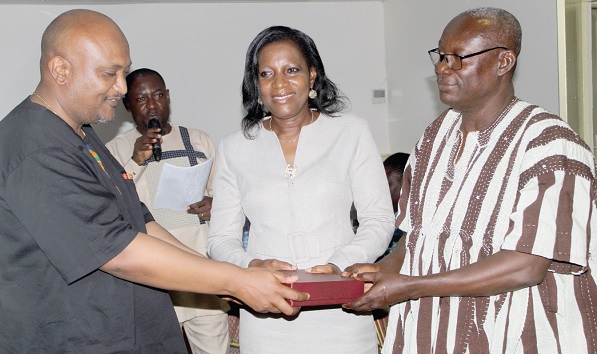 • Robel Wamisho (left), World Vision Wash Technical Programme Manager, presenting an award to Theodora Adomako-Adjei (middle), Head of Extension Services, Community Water and Sanitation Agency, and Kwame Sekyi-Akomea (right), Director, Admin and HR, Community Water and Sanitation Agency. Picture: ESTHER ADJORKOR ADJEI