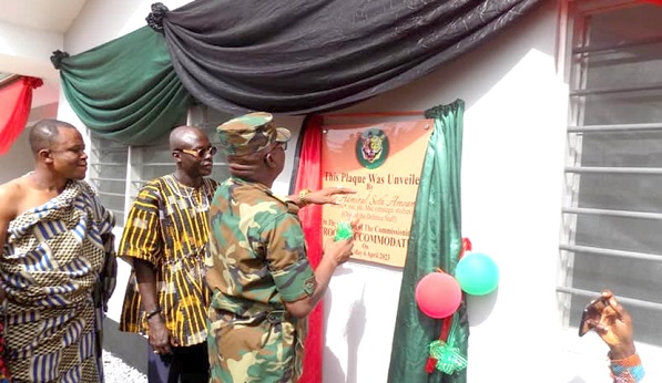• Vice Admiral Seth Amoama, Chief of the Defence Staff, unveiling a plaque to inaugurate the self-contained residential apartments (inset) at the Jungle Warfare School at Akyem Achiase in the Eastern Region 