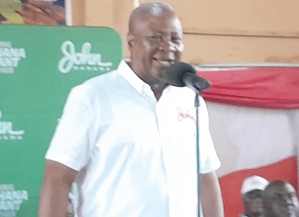 • Former President John Dramani Mahama (left) addressing party delegates 