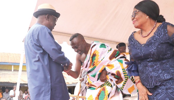 • Albert Kan-Dapaah (left), Minister of National Security, congratulating J. K. Mensah at the ceremony. Looking on is Nana Akosua Adomah Mensah, his wife