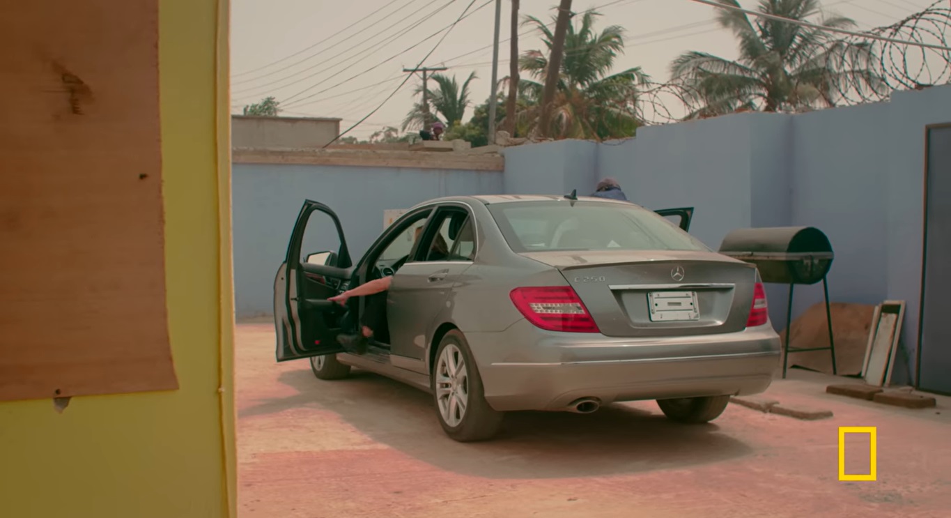 The investigative journalist speaks to sources and people involved in the US and follows it up with a trip to Accra, Ghana to speak to some of the people associated with the business and able to show a sample of a stolen vehicle - Mercedez Benz C250 - in the streets of Accra that is in a garage and being offered for sale.  The documentary establishes that particular Mercedez Benz had a VIN swapped with a salvaged Mercedez.