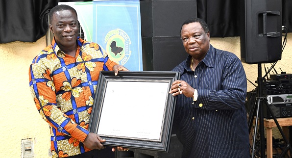 • Ignatius Baffour Awuah, Minister of Employment and Labour Relations, receiving a certificate of honour from Dr Francis Atwoli, President of OATUU, on behalf of Nana Addo Dankwa Akufo-Addo, President of Ghana. Picture: EBOW HANSON