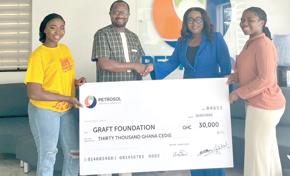 • Lawrencia Himans (2nd from right), Head of Finance and Planning at PETROSOL, making the presentation to Dr Brainerd Anani of the GRAFT Foundation. With them is Susuana Efua Amissah (right) of PETROSOL and an official of the foundation