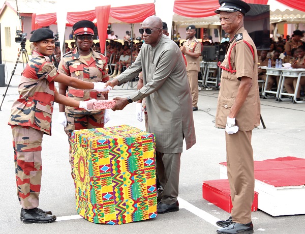 Ambrose Dery (2nd from right), Minister for the Interior, presenting the Overall Best Recruit Award to Recruit Fireman Enock Owusu Amoako (left), while Julius Kuunuor (right), Chief Fire Officer, looks on.  Picture: ELVIS NII NOI DOWUONA