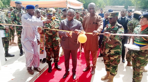 •Dominic Nitiwul (middle), Defence Minister, being assisted by Shani Alhassan Shaibu (2nd from right), the Northern Regional Minister, and Lieutenant Colonel Jerry Ankuyi (right), Commanding Officer, to inaugurate the facility. INSET: A view of the facility