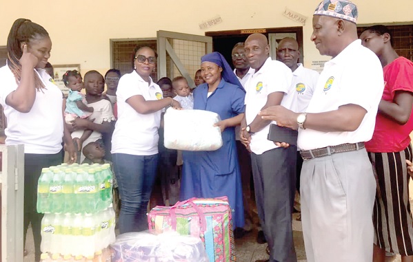  • Rev Sister Stan Terese Mario Mumuni (3rd from right), Founder of the Nazareth Home of God’s Children, receiving the items from officials of CFTV