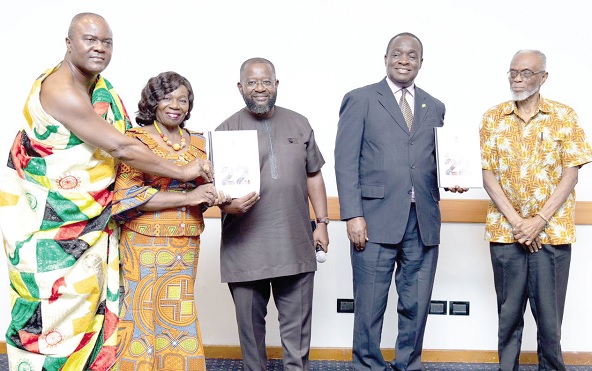• Kwame Jantuah (middle), former Vice Chairman, PIAC, being assisted by Prof. Kwame Adom-Frimpong (2nd from right), Chairman, PIAC; Emerita Professor Elizabeth Ardayfio-Schandorf (2nd from left), member, PIAC; Odeefuo Amoakwa Buadu VIII (left), Omanhene, the Breman Traditional Area and member, PIAC, and Professor Akilagpa Sawyerr (right), former Vice Chancellor, University of Ghana, to launch the 2022 PIAC Annual Report
