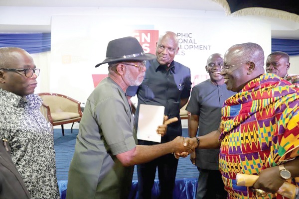Akyamfour Asafo Boakye Agyeman-Bonsu (right), Chief of Asafo and Akwamuhene of the Kumasi Traditional Council, in a handshake with Fr Professor Godfrey Nzamujo, Founder of the Songhai Centre in the Republic of Benin. Looking on is Ato Afful (2nd from left), Managing Director of the GCGL, and Abraham Dwuma Odoom, an Agricultural Consultant for the J.A. Kufour Foundation. Pictures: EMMANUEL BAAH