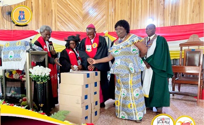 Very Rev. Evangelist Gordon Duah (right) presenting 1,000 New Testament Bibles to Rt. Rev. Moses K. Jackson for the children’s ministry of the Somanya Diocese 