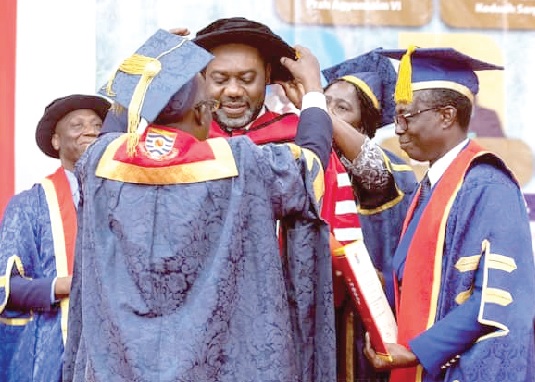 Seven honorees at the University of Cape Coast's Special Congregation on Saturday. INSET: Dr Matthew Opoku Prempeh, Minister for Energy, being robed after receiving an honorary doctorate degree at the ceremony