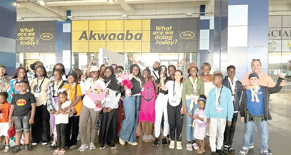 The gallant contestants and their parents after they disembarked at the Kotoka International Airport 