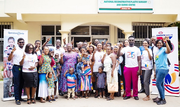 Staff members of Engen Ghana Limited and some cleft patients with their mothers at the Korle Bu Teaching Hospital
