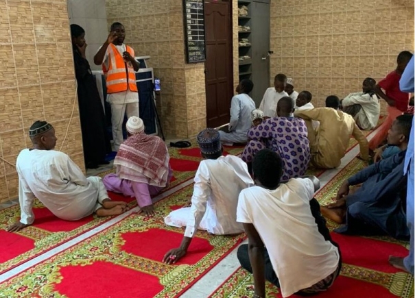  ECG officials educating customers at the Ho Zongo Mosque