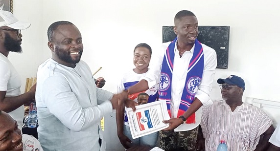 Nana Abrokwa Asare (2nd from right) submitting his nomination form to Christian Okomfo, the constituency secretary at Atimpoku