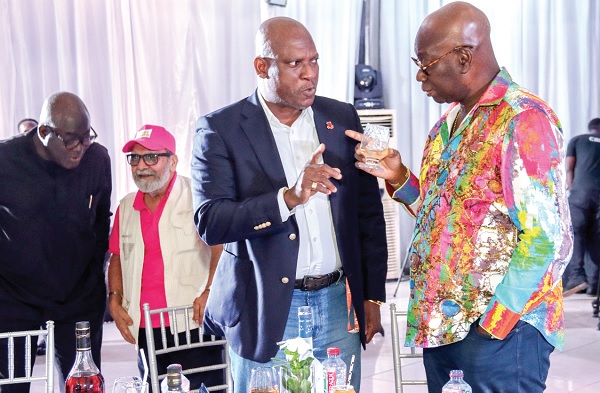 Reginald Laryea (right), President, DreamChild Foundation, interacting with Ato Afful (2nd from right), MD, Graphic Communications Group Limited. Picture: ERNEST KODZI