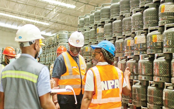 Some officers of the NPA inspecting a cylinder manufacturing plant