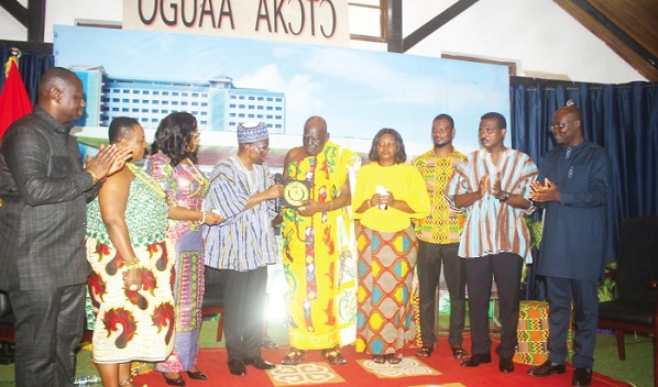 Alban Bagbin (4th from left), Speaker of Parliament, and Osabarima Kwesi Atta (5th from right) flanked by some dignitaries, exchanging gifts 