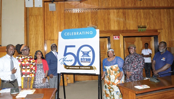 Prof. Esi Sutherland-Addy (3rd from  right), Board Chair of Afram Publications  Limited; Harriet Tagoe (2nd from left), Managing Director of the company, and Nana Kwasi Gyan-Apenteng (2nd from right), former Chairman of the National Media Commission, after unveiling the anniversary logo of the company. With them are some staff of the company and invited guests. Picture: ALBERTA MORTTY