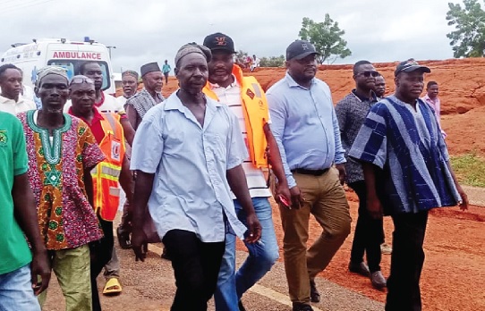 Stephen Jalulah (middle), Deputy Minister of Roads and Highways; Yidana Zakaria (right), North East Regional Minister; Issahaku Aremeyaw Somo (2nd from left), West Mamprusi MCE, and  other officials inspecting the roads