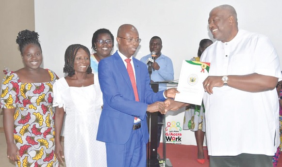 Henry Quartey (right), Greater Accra Regional Minister, presenting an award to Dr Emmanuel Srofenyoh, Medical Director of the Greater Accra Regional Hospital