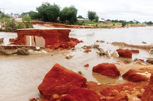 One of the roads washed away by the floods One of the roads washed away by the floods