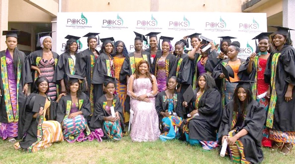 Rawlene Abena Pokua Guh (seated), CEO of POKS Vocational Training Institute, with the graduating students