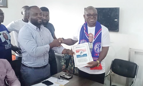 Paul Asare Ansah (right) presenting the nomination forms to Christian Addo Okomfo, the NPP Asuogyaman Constituency Secretary
