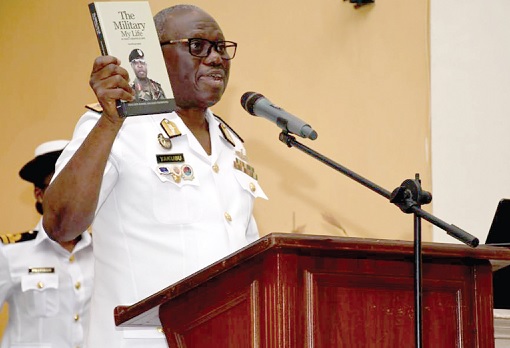 Rear Admiral Issah Yakubu, Chief of Naval Staff, launching the book